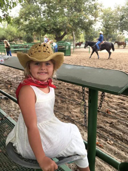 Little girl smiling at The Rodeo event